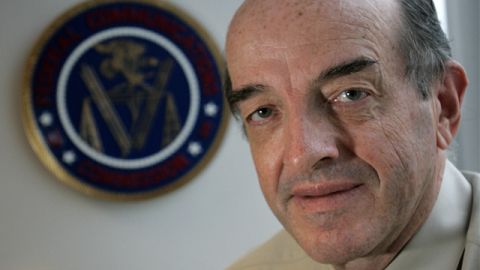Michael Copps, a member of the Federal Communications Commission, poses in his office, Oct. 15, 2004, in Washington. Copps, a Democrat, has often clashed with Bush-designated commission Chairman Michael Powell. The FCC seal is on the wal behind Copps. (AP Photo/Lawrence Jackson)