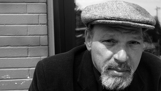 Pulitzer Prize-winning playwright August Wilson poses during a visit to a coffee shop in his Seattle neighborhood. May 2003. (AP Photo/Ted S. Warren)