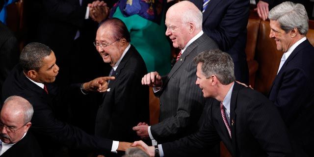President Barack Obama greets Sen. Daniel Inouye, Sen. Patrick Leahy, Sen. Scott Brown, and Sen. John Kerry, on Capitol Hill in Washington. January 2012. (AP Photo/Evan Vucci)