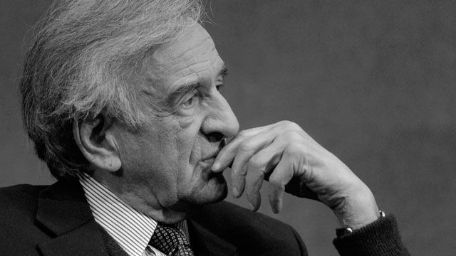 Elie Wiesel listens to a question posed by moderator Marvin Kalb (not shown) during a program at the National Press Club. November 2006. (AP Photo/Nick Wass)