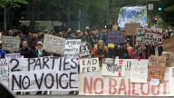 Protesters form a wall of signs at the Occupy Portland camp in downtown Portland, Ore. October 2011. (AP Photo/Don Ryan)