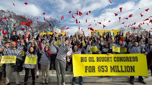 Protestors against the Keystone XL pipeline dressed as referees throw red penalty flags during a rally on Capitol Hill in Washington. Jaunary 2012. (AP Photo/Manuel Balce Ceneta)