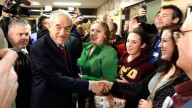 Republican presidential candidate Rep. Ron Paul shakes hands with caucus goers as he visits a caucus site in Coon Rapids, Minn. February 2012 (AP Photo/Charles Rex Arbogast)