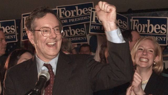 Steve Forbes celebrates a primary victory at his campaign headquarters in Phoenix. February 1996. (AP Photo/Jeff Robbins)