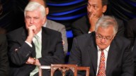 Sen. Chris Dodd, D-Conn., and Rep. Barney Frank, D-Mass., wait for President Barack Obama to sign the Dodd-Frank Wall Street Reform and Consumer Protection financial reform bill at the Ronald Reagan Building in Washington. July 2010. (AP Photo/Charles Dharapak)