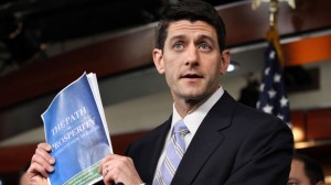 House Budget Committee Chairman Rep. Paul Ryan, R-Wis., holds up a copy of his budget plan entitled "The Path to Prosperity," Tuesday, March 20, 2012, during a news conference on Capitol Hill in Washington. (AP Photo/Jacquelyn Martin)