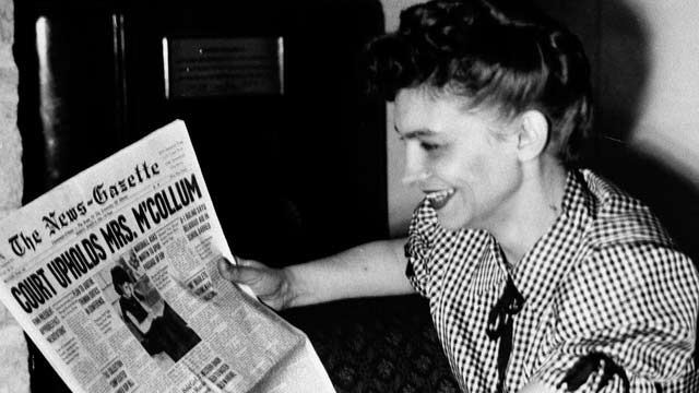 Vashti McCollum smiles as she reads of her victory before the U.S. Supreme Court in her suit to bar religious eduction from the Champaign high schools. March 1948. (AP Photo)