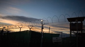 In this file image reviewed by the U.S. Military, the sun rises over Guantanamo detention facility, at the U.S. Naval Base, in Guantanamo Bay, Cuba, Nov. 19, 2008. (AP Photo/Brennan Linsley)