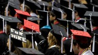 Students attend graduation ceremonies at the University of Alabama in Tuscaloosa, Ala. August 2011. (AP Photo/Butch Dill)