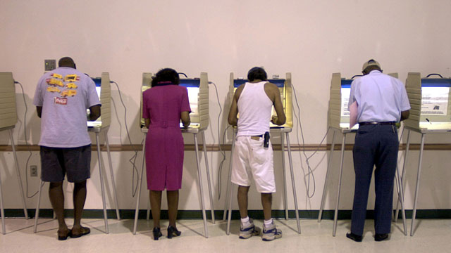 Voters mark their ballots during Florida's primary elections. September 2002. (AP photo/Oscar Sosa)
