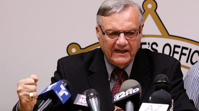 A defiant Maricopa County Sheriff Joe Arpaio, pounds his fist on the podium as he answers questions regarding the Department of Justice announcing a federal civil lawsuit against Sheriff Arpaio and his department. May 2012. (AP Photo/Ross D. Franklin)