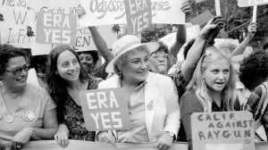 Bella Abzug, center with hat, smiles as she holds up her ERA sign in a pro-equal rights demonstration on New York's Fifth Avenue, Aug. 26, 1980. (AP Photo)