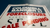 A foreclosed house sign with sale pending. March 2011. (AP Photo/Don Ryan)