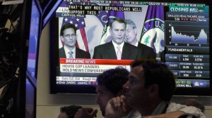 House Speaker John Boehner, R-Ohio, is seen on a television screen on the floor of the New York Stock Exchange Monday, Aug. 1, 2011. (AP Photo/Richard Drew)