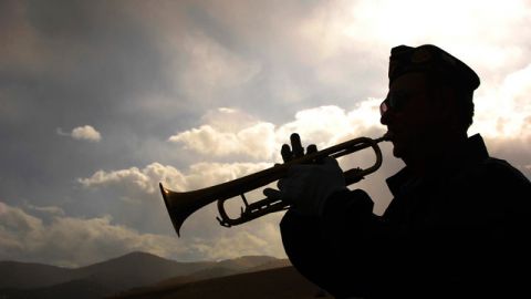 Despite a dwindling pool of bugler players, Navy veteran and long-time musician Boyce Fowler, photographed keeps the art of Taps alive by playing at military burials at Fort Harrison, Mont. October 2008. (AP Photo/The Independent Record, Lisa Kunkel)
