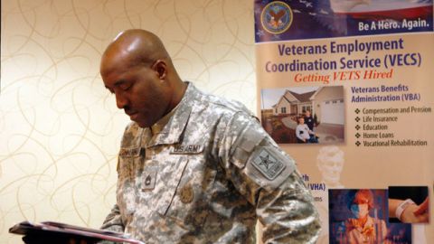 Army Sgt.1st Class Lonell Zimmerman, of Vineland, N.J., looks over some papers as he attends a job fair aimed at helping military and former military members transition to civilian jobs. May 2011 (AP Photo/Mel Evans)