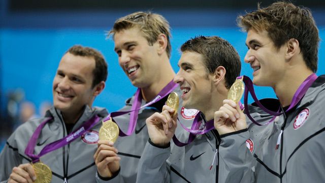United States' men's 4 X 100-meter medley relay team: Brendan Hansen, Matthew Grevers, Michael Phelps and Nathan Adrian, hold their gold medals at the Aquatics Centre in the Olympic Park during the 2012 Summer Olympics in London. August 2012. (AP Photo/Matt Slocum)