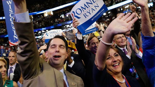 Wisconsin Gov. Scott Walker and his wife Tonette cheer as Republican vice presidential nominee, Rep. Paul Ryan addresses the Republican National Convention in Tampa, Fla., August 2012. (AP Photo/David Goldman)