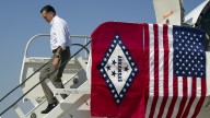 Mitt Romney arrives at Adams Field Airport for a fundraising event on Wednesday in Little Rock, Ark. August 2012. (AP Photo/Evan Vucci)