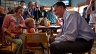 Republican presidential candidate, former Massachusetts Gov. Mitt Romney makes a stop at Millie's to talk with voters before attending a fundraising event in Nantucket, Mass. August 2012. (AP Photo/Evan Vucci)