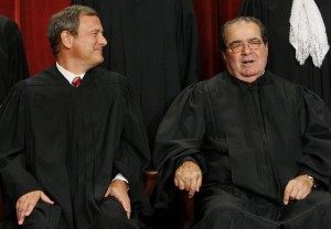 Chief Justice John Roberts, left, and Associate Justice Antonin Scalia sit for a new group photograph, Tuesday, Sept. 29, 2009. (Photo by Charles Dharapak/AP)