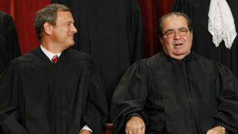 Chief Justice John Roberts and Associate Justice Antonin Scalia sit for a new group photograph at the Supreme Court in Washington. September 2009. (AP Photo/Charles Dharapak)