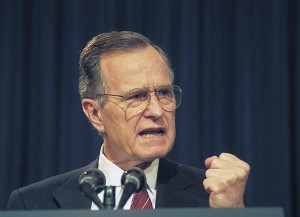 President George H. W. Bush gestures while addressing the American Legislative Exchange Council in 1992, Washington, D.C. (AP Photo/Barry Thumma)