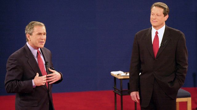 Republican presidential candidate, Texas Gov. George W. Bush speaks as Democratic presidential candidate Vice President Al Gore watches during their third and final debate at Washington University in St. Louis. October 2000. (AP Photo/Ed Reinke, File)