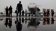 Visitors tour the Bombardier Global Express XRS corporate jet during the Asian Aerospace Show in Hong Kong. March 2011. (AP Photo/Kin Cheung)