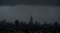 The Empire State Building and large portions of midtown Manhattan are seen without power as a result of Hurricane Sandy. October 2012. (AP Photo/Charles Sykes)