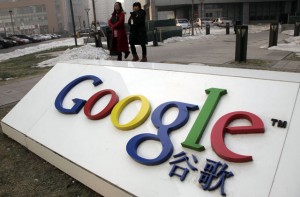 Women walk past the Google logo outside the Google China headquarters Beijing, China. Citing the sensitivity of the talks, Google officials won't say how the negotiations have gone since the company issued its Jan. 12, 2010 threat to shut down its China-based search engine and possibly leave the country altogether if the government doesn't tear down the so-called 'Great Firewall' that blocks certain information and images. (AP Photo/Ng Han Guan, file)