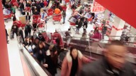 Shoppers take advantage of Black Friday sales in the early morning at a Target store. November 2010. (AP Photo/Kiichiro Sato)