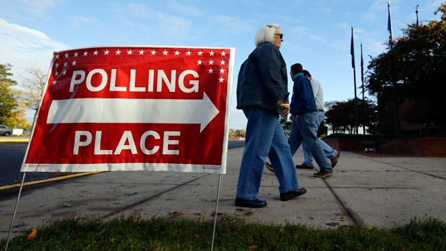 Voters arrive and depart during early voting at a polling place at the Wicomico County Youth and Civic Center in Salisbury, Md. October 2012. (AP Photo/Alex Brandon)