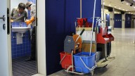Pictured is a janitor cleaning a restroom next to the congress center's main hall in Davos Switzerland. January 2007. (AP Photo/Keystone, Alessandro della Valle)