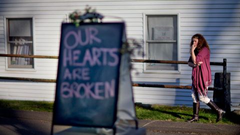 Shop owner Tamara Doherty, paces outside her store just down the road from Sandy Hook Elementary School in Newtown, Conn. December 2012. (AP Photo/David Goldman)