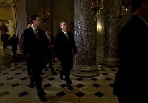 Speaker of the House John Boehner, R-Ohio, center, returns to his office from the House chamber, as talks continue regarding the "fiscal cliff" bill passed by the Senate Monday night, on Tuesday, Jan. 1, 2013 at the Capitol in Washington. (AP Photo/Jacquelyn Martin)