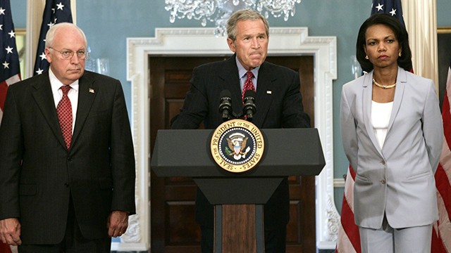 President Bush, center, pauses during remarks about the Middle East at the State Department on Monday, Aug. 14, 2006 in Washington. From left is Vice President Dick Cheney, Bush, and Secretary of State Condoleezza Rice. (AP Photo/Evan Vucci)