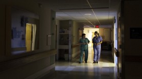 Nurses walk under dimmed lighting during 'quiet time' at the Newborn Family Unit at the Massachusetts General Hospital in Boston. (AP Photo/Elise Amendola)