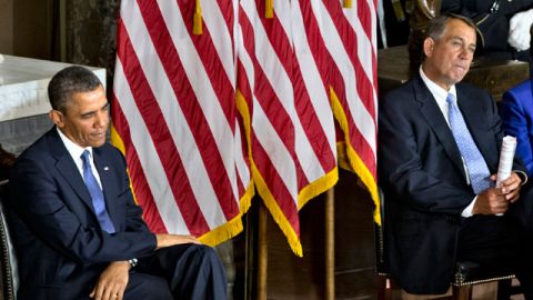 President Barack Obama, left, and House Speaker John Boehner of Ohio sit during a ceremony in the Capitol's Statuary Hall. (AP Photo/J. Scott Applewhite)