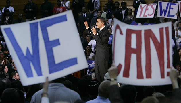 Supporters hold up hand-painted signs as Democratic presidential hopeful Sen. Barack Obama, center, D-Ill., addresses a rally at Yanitelli Center on St. Peter's College campus in Jersey City, N.J., Wednesday Jan. 9, 2008. It is this way wherever Obama goes. Whenever Americans have been challenged, he tells them, there has been only one response. It comes back to him in a deafening roar that surges into a vibrating chant: "YES WE CAN!" (AP Photo/Mel Evans)