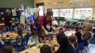 Teacher Sarah Morse, center, helps during lunch at the Eastham Community Center Claskamas County Children's Commission Head Start in Oregon City, Ore. (AP Photo/Rick Bowmer)