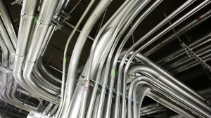 Electrical conduits are installed overhead in a server room in New York. (AP Photo/Mark Lennihan)