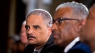 Attorney General Eric Holder, left, attends a ceremony on Capitol Hill in Washington, Wednesday, July 31, 2013, in observance of the 50th anniversary of the March on Washington for Jobs and Freedom. (AP Photo/Manuel Balce Ceneta)