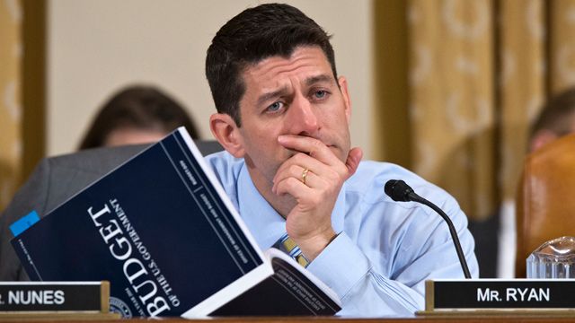 House Budget Committee Chairman Rep. Paul Ryan, R-Wis., a member of the House Ways and Means Committee, holds a copy of President Barack Obama's fiscal 2014 budget proposal book as he questions Health and Human Services (HHS) Secretary Kathleen Sebelius on Capitol Hill in Washington, Friday, April 12, 2013, as Sebelius testified before the House Ways and Means Committee hearing on the HHS fiscal 2014 budget request. (AP Photo/J. Scott Applewhite)