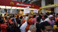 Protesting fast food workers demonstrate outside a McDonald's restaurant on New York's Fifth Avenue, Thursday, Aug. 29, 2013. (AP Photo/Richard Drew)