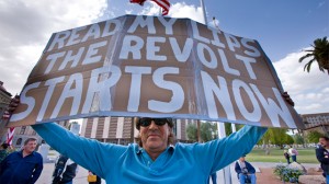 Phoenix Arizona, USA, April, 2009: Tea party attendee protests government policies with homemade sign. Courtesy: iStock