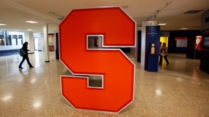 A Syracuse University logo is displayed inside the lobby of the Carmelo K. Anthony Basketball Center at Syracuse University in Syracuse, NY. (AP Photo/David Duprey)