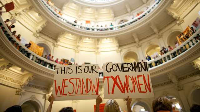 In this July 12, 2013, file photo, abortion rights supporters rally on the floor of the State Capitol rotunda in Austin, Texas. (AP Photo/Tamir Kalifa, File)