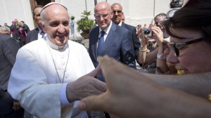 Pope Francis greets the faithful as he leaves the village of Castel Gandolfo, the pontiffs' summer residence in the hills overlooking Rome in August. (AP Photo/Andrew Medichini, File)