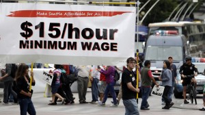 Demonstrators protesting for $15/hour wages and proper treatment for fast-food workers march in downtown Seattle. (AP Photo/Elaine Thompson, File)